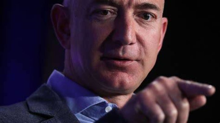 What time Jeff Bezos wake up?