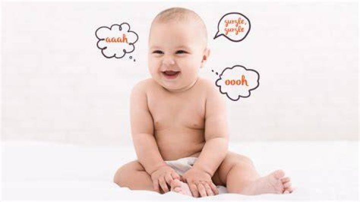 When do babies start cooing and smiling?